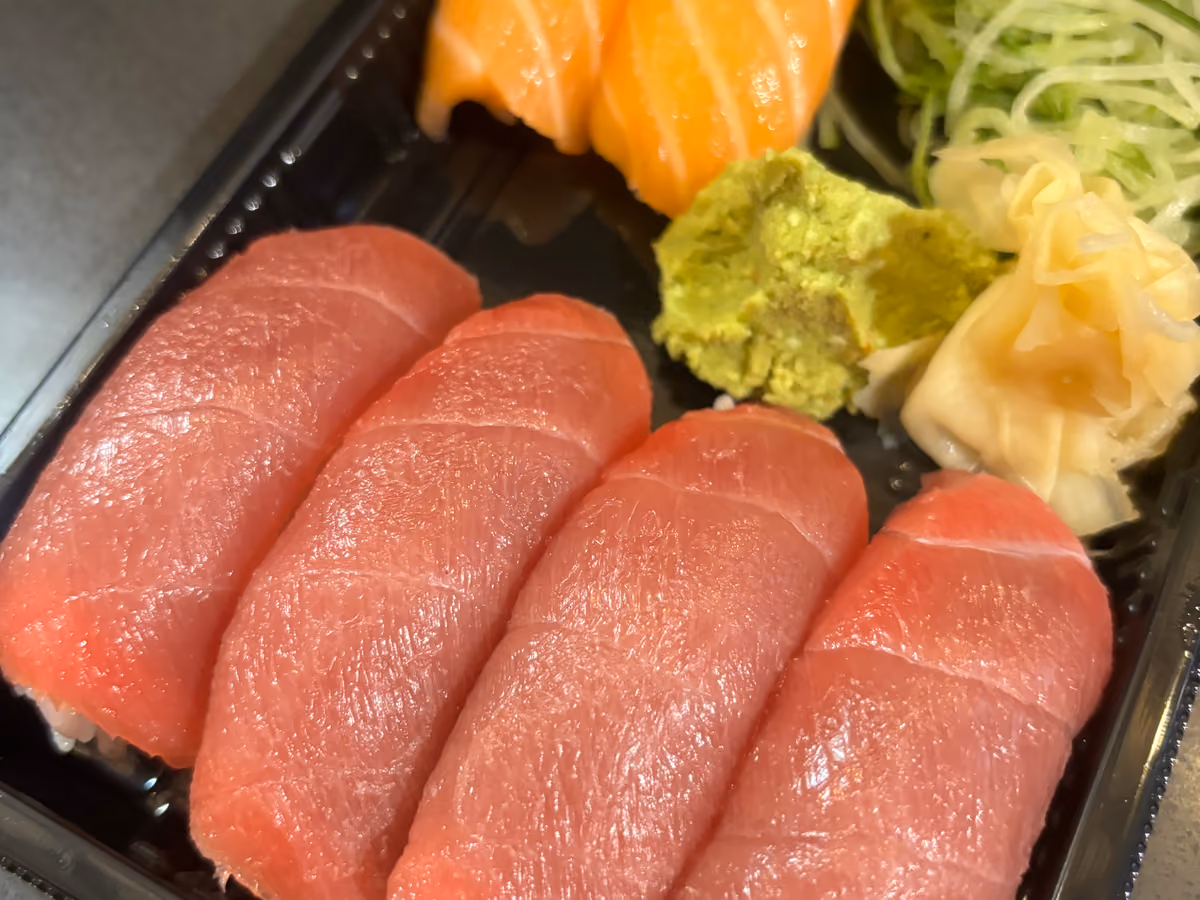 Bluefin tuna and salmon nigiri boxed for delivery at Hito