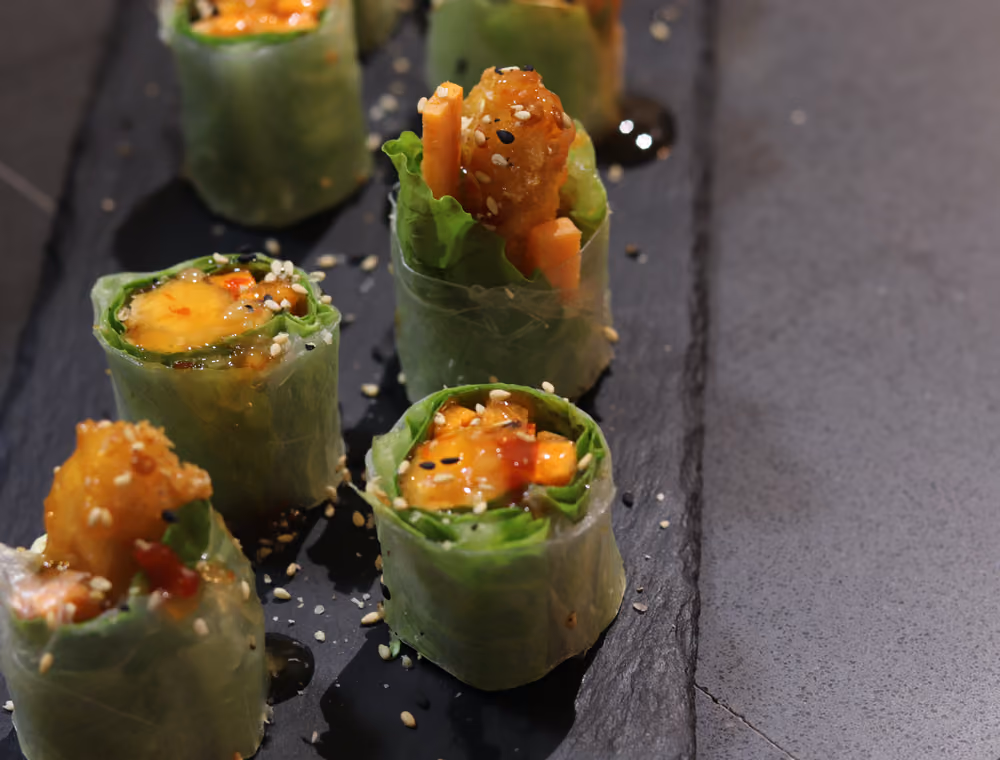 Ensalada Ebi Spring Roll - rice-paper rolls of salad and prawn, cut and plated on slate at Hito