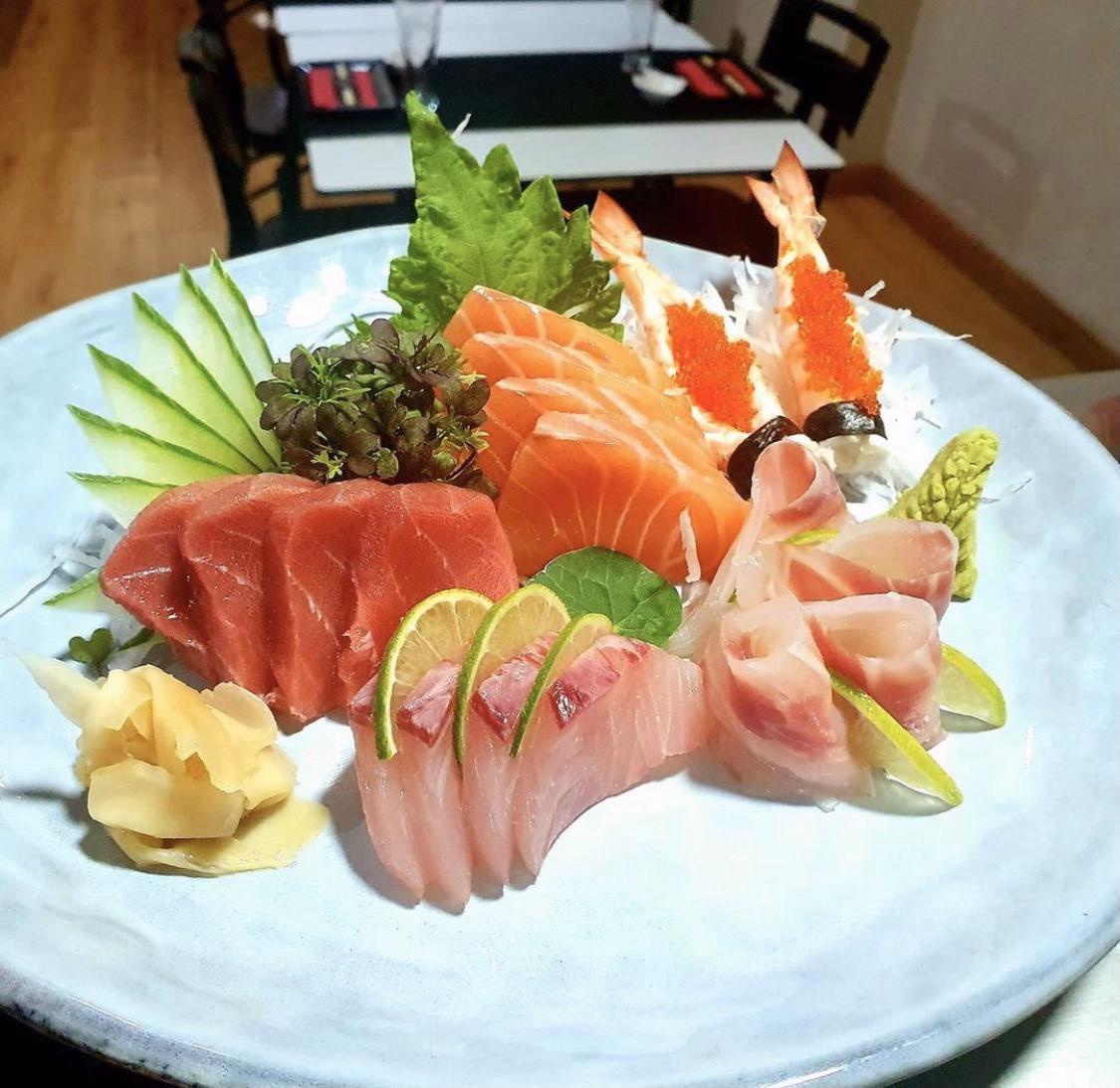 A Sashimi Moriawase of tuna, salmon, white fish and prawn with fresh garnishes at Hito